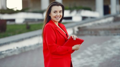 woman-red-jacket-using-tablet_1157-32708